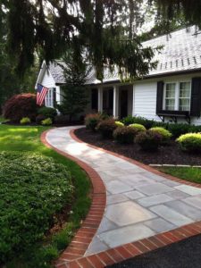 Exterior brick and concrete walkway connecting porch to driveway | MTP Construction in Mt. Laurel, NJ